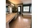 This bathroom features a large tub and vanity with double sinks and white cabinets at 2330 Winthorp Ridge Rd, Charlotte, NC 28270