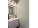 Half bath with white vanity, modern fixtures, and decorative wall accents at 2330 Winthorp Ridge Rd, Charlotte, NC 28270