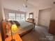 Large bedroom with ceiling fan, natural light, and a relaxing atmosphere at 2330 Winthorp Ridge Rd, Charlotte, NC 28270