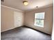 This bedroom features carpet and a closet at 2330 Winthorp Ridge Rd, Charlotte, NC 28270
