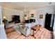 Cozy living room with fireplace, ceiling fan, and comfortable seating arrangement at 2330 Winthorp Ridge Rd, Charlotte, NC 28270