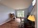 Home office with two desks, hardwood floors, natural lighting, and neutral walls at 2330 Winthorp Ridge Rd, Charlotte, NC 28270