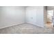 Neutral bedroom with plush carpet and a double door closet at 2522 Mabel Ln, Monroe, NC 28110