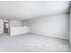 Spacious bonus room with neutral carpet and a view of the stairs and landing at 2522 Mabel Ln, Monroe, NC 28110