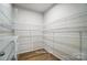 Spacious walk-in closet with wire shelving and wood-look flooring at 2522 Mabel Ln, Monroe, NC 28110