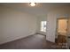 Bedroom with neutral carpet and walls and a window to let in natural light at 3011 Buffett Ln # 33, Monroe, NC 28110