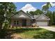 Charming single-story home with a two-car garage and a well-manicured lawn on a sunny day at 3011 Buffett Ln # 33, Monroe, NC 28110