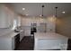Well-equipped kitchen featuring an island, stainless steel appliances, and bright white cabinetry at 3011 Buffett Ln # 33, Monroe, NC 28110