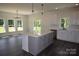 Stylish kitchen with a center island, stainless steel appliances, and modern pendant lights at 3011 Buffett Ln # 33, Monroe, NC 28110