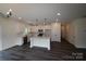 Modern kitchen featuring an island, stainless steel appliances, white cabinets, and sleek countertops at 3011 Buffett Ln # 33, Monroe, NC 28110