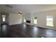 Bright living room with a fireplace, large windows, and wood-look flooring, offering ample natural light at 3011 Buffett Ln # 33, Monroe, NC 28110