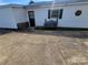Backyard featuring a quaint bench, tidy landscaping, and convenient access at 309 E 11Th St, Kannapolis, NC 28083