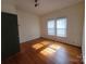 Spacious bedroom with hardwood floors and windows, with neutral walls and a closet at 309 E 11Th St, Kannapolis, NC 28083