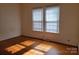 Light-filled bedroom with hardwood floors and bright windows providing natural light at 309 E 11Th St, Kannapolis, NC 28083
