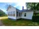 Exterior side view shows sunroom addition with many windows for natural light at 309 E 11Th St, Kannapolis, NC 28083