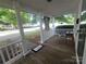 Inviting front porch featuring white columns and a cozy entrance mat at 309 E 11Th St, Kannapolis, NC 28083