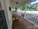 Charming front porch with white columns and a porch swing, perfect for relaxing outdoors at 309 E 11Th St, Kannapolis, NC 28083