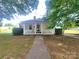 Charming home featuring a quaint front porch and well-manicured lawn at 309 E 11Th St, Kannapolis, NC 28083