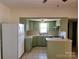 Kitchen featuring green cabinets, white countertops, and tile flooring at 309 E 11Th St, Kannapolis, NC 28083