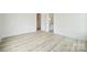 Bedroom with en-suite bathroom entrance, featuring neutral walls and hardwood flooring at 3622 E Brief Rd, Monroe, NC 28110
