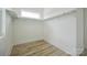 Bright closet features wood floor and window with natural light, shelving and bars for storage at 3622 E Brief Rd, Monroe, NC 28110