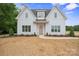 Charming two-story home with white siding, complemented by a well-manicured lawn and inviting walkway at 3622 E Brief Rd, Monroe, NC 28110