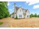 New construction home with a white exterior, chimney and landscaping in the front yard at 3622 E Brief Rd, Monroe, NC 28110
