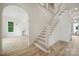 Welcoming foyer featuring staircase, light wood floors, and an open floor plan at 3622 E Brief Rd, Monroe, NC 28110