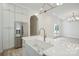 Spacious kitchen with a large island, stainless steel refrigerator, and pendant lighting at 3622 E Brief Rd, Monroe, NC 28110