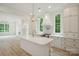 Gourmet kitchen boasts a large island, stainless steel appliances, and elegant pendant lighting at 3622 E Brief Rd, Monroe, NC 28110