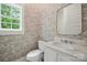 Stylish powder room featuring patterned wallpaper, elegant marble countertop vanity, and natural light at 3622 E Brief Rd, Monroe, NC 28110