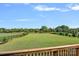 Expansive backyard featuring lush lawn, mature trees, and serene views, perfect for outdoor enjoyment and recreation at 409 Wheatberry Hill Dr, Matthews, NC 28104