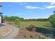 Lush green backyard with mature trees and landscaping, offering a private and serene outdoor space for relaxation and enjoyment at 409 Wheatberry Hill Dr, Matthews, NC 28104