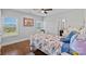 Well-lit bedroom with a window view, hardwood floors, and ample space at 409 Wheatberry Hill Dr, Matthews, NC 28104