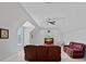 Spacious bonus room offers versatile layout with a ceiling fan and natural light at 409 Wheatberry Hill Dr, Matthews, NC 28104