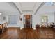 Elegant foyer with high ceilings, hardwood floors, and a decorative front door with sidelights at 409 Wheatberry Hill Dr, Matthews, NC 28104