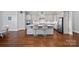 Well-equipped kitchen with stainless steel appliances, a center island with seating, and ample cabinet space at 409 Wheatberry Hill Dr, Matthews, NC 28104