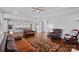 Open-concept living room with hardwood floors, fireplace, and seamless connection to the kitchen at 409 Wheatberry Hill Dr, Matthews, NC 28104