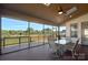 Relax on this screened patio with a dining area and views of the surrounding landscape at 409 Wheatberry Hill Dr, Matthews, NC 28104
