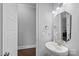 Neutral powder room with a modern vessel sink, faucet, and large mirror for guests at 409 Wheatberry Hill Dr, Matthews, NC 28104