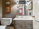 Cozy half bathroom with a vanity and decorative mirror at 4464 Mullens Ford Rd, Charlotte, NC 28226