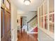 Inviting foyer with hardwood floors, staircase and natural light at 4464 Mullens Ford Rd, Charlotte, NC 28226