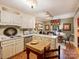 Cozy kitchen with brick floors and ample counter space flows into a sitting area at 4464 Mullens Ford Rd, Charlotte, NC 28226
