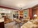 Living room showcasing seamless flow into a well-lit kitchen and sitting area at 4464 Mullens Ford Rd, Charlotte, NC 28226