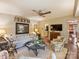 Comfortable living room featuring a ceiling fan, wainscoting, and hardwood floors at 4464 Mullens Ford Rd, Charlotte, NC 28226