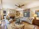 Inviting living room with a fireplace, bookshelves, and comfortable seating at 4464 Mullens Ford Rd, Charlotte, NC 28226