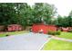 Large backyard features multiple sheds with a gravel area and partial grassy sections at 475 Dot Faris Rd, Catawba, SC 29704