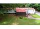 Charming home featuring a screened-in porch and a lovely landscaped yard with a red tile walkway at 475 Dot Faris Rd, Catawba, SC 29704