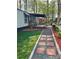 Single story home with a covered porch, paved walkway, gravel driveway, and landscaped yard at 475 Dot Faris Rd, Catawba, SC 29704