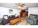 Open-concept living room with view of kitchen area, ample seating, and ceiling fan at 475 Dot Faris Rd, Catawba, SC 29704